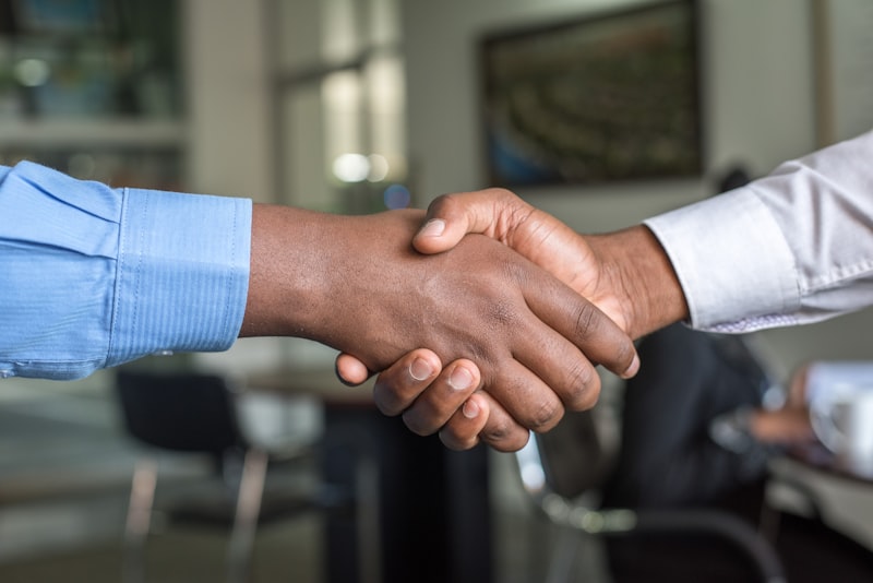 Real estate agreement handshake between agent and client after successful deal of a commercial real estate Scottsdale AZ