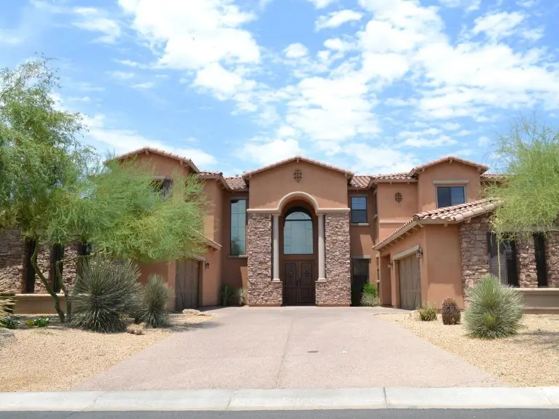 east valley az communities luxury home with desert landscaping and modern architecture